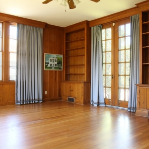 Den | Natural stained wood walls in the brightly lit den